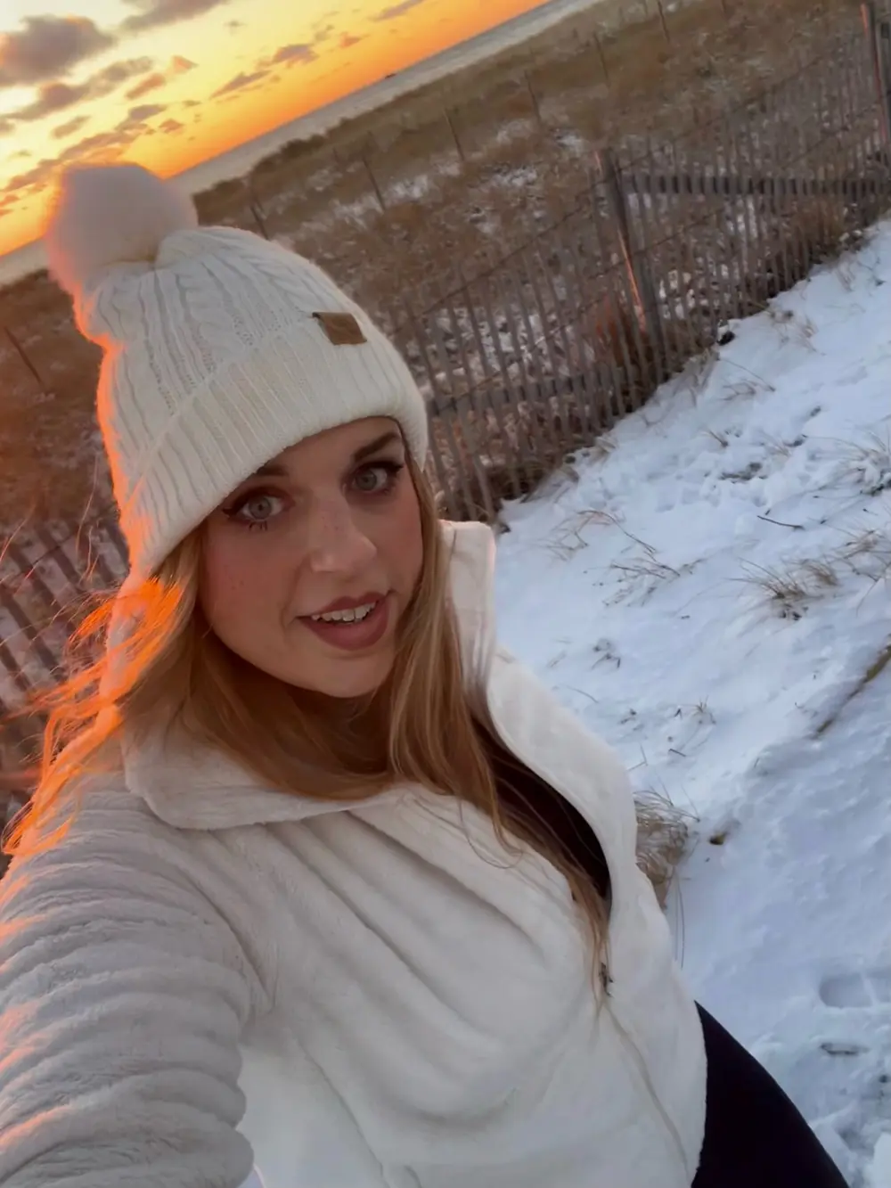 Emma Shorebreak watching a winter sunset over Herring Cove Beach in the Cape Cod National Seashore near Provincetown