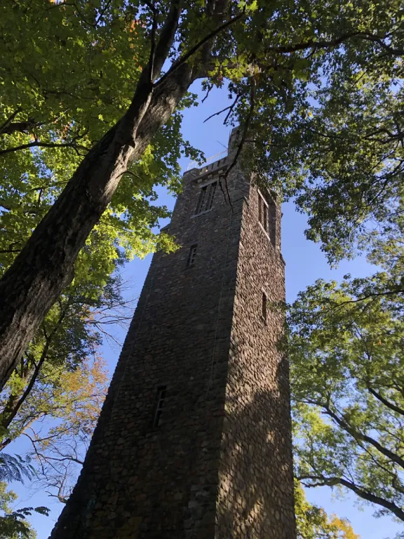 Bowman's Hill Tower rising through the trees near New Hope Pennsylvania, the stone tower that reminded Emma Shorebreak of Box Hill in Emma